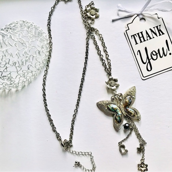 Elegant Silver Butterfly Necklace with Floral Details - Picture 6 of 11